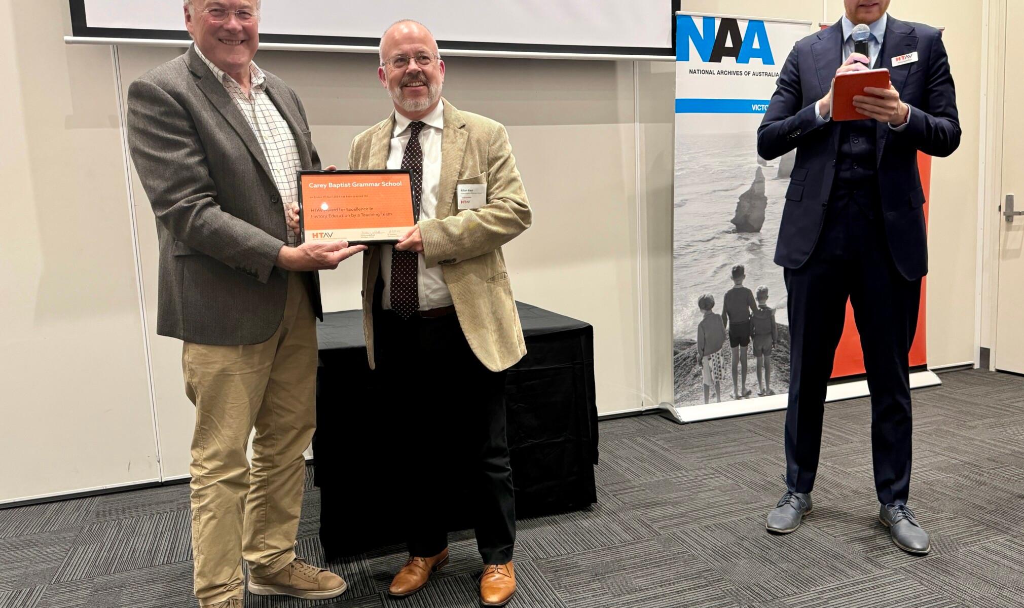 Allan Kerr (centre), Leader of Learning – Humanities at Carey, with Professor Peter McPhee AM (left), provost of the University of Melbourne and patron of the HTAV; and Mr Ashley Keith Pratt (right), President of the HTAV Board