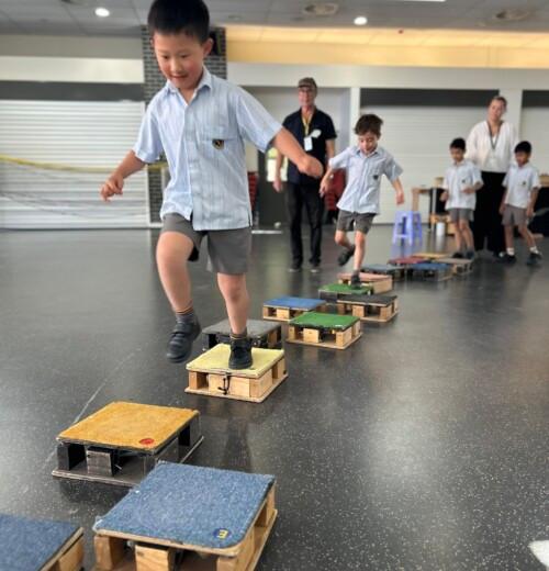 Year 1 students making music with ding boxes