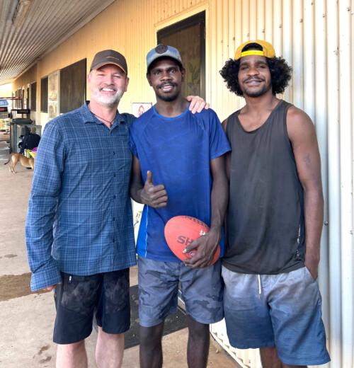 Some of the Robinson River School alumni came to reconnect while Michael Nelson (left) visited with the Carey student group!