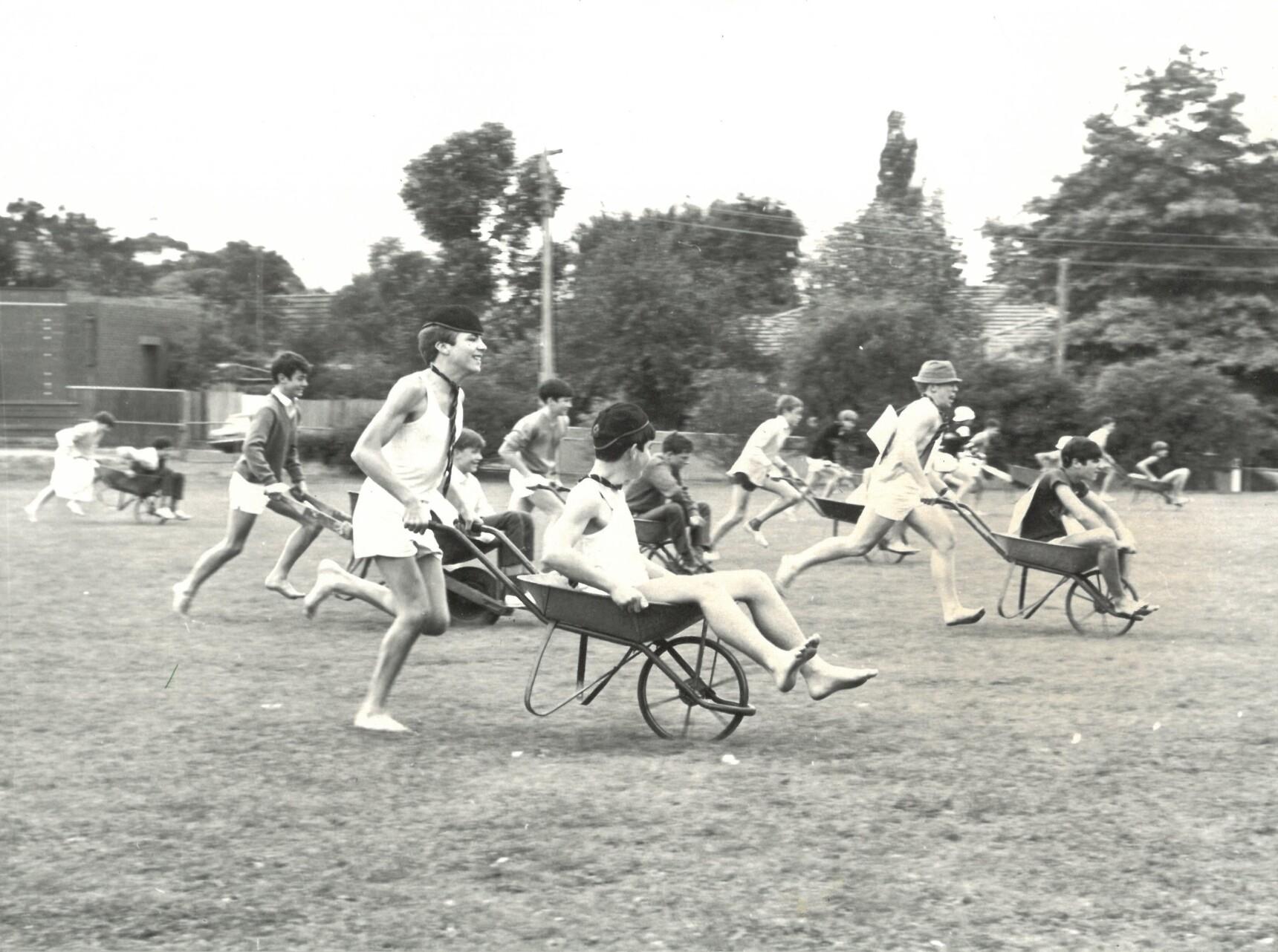 A House wheelbarrow racing competition in 1954.